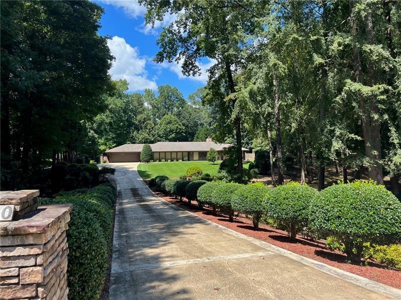 Private entrance to beautiful 1.8 acre property.