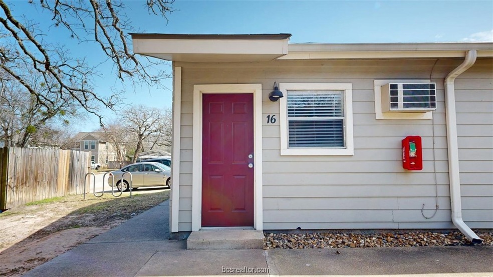 View of exterior entry featuring fence