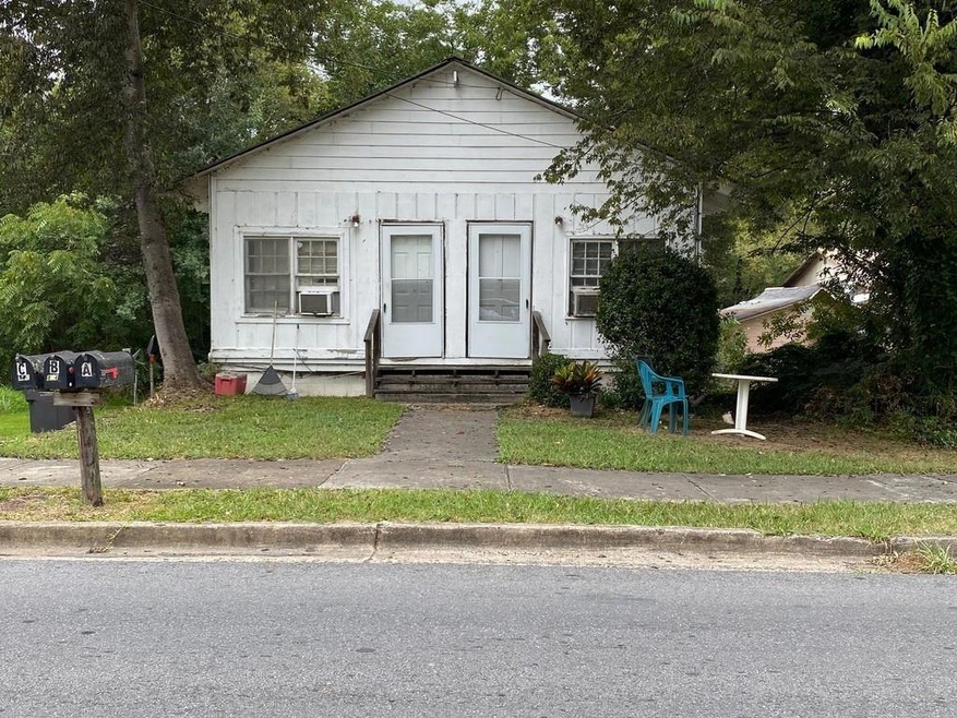 Bungalow-style home with cooling unit