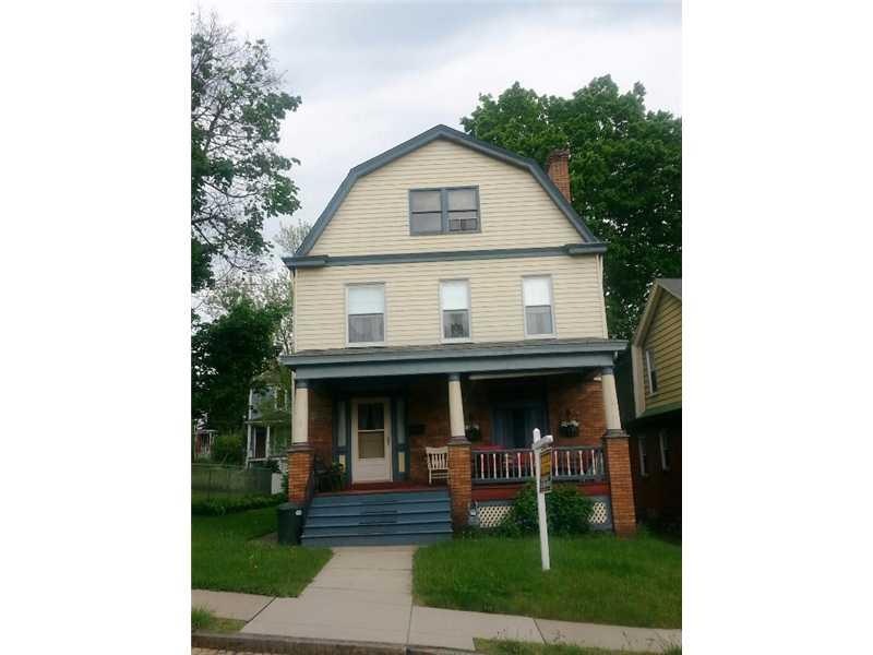 Exterior Front. Relax on the large front porch.  T