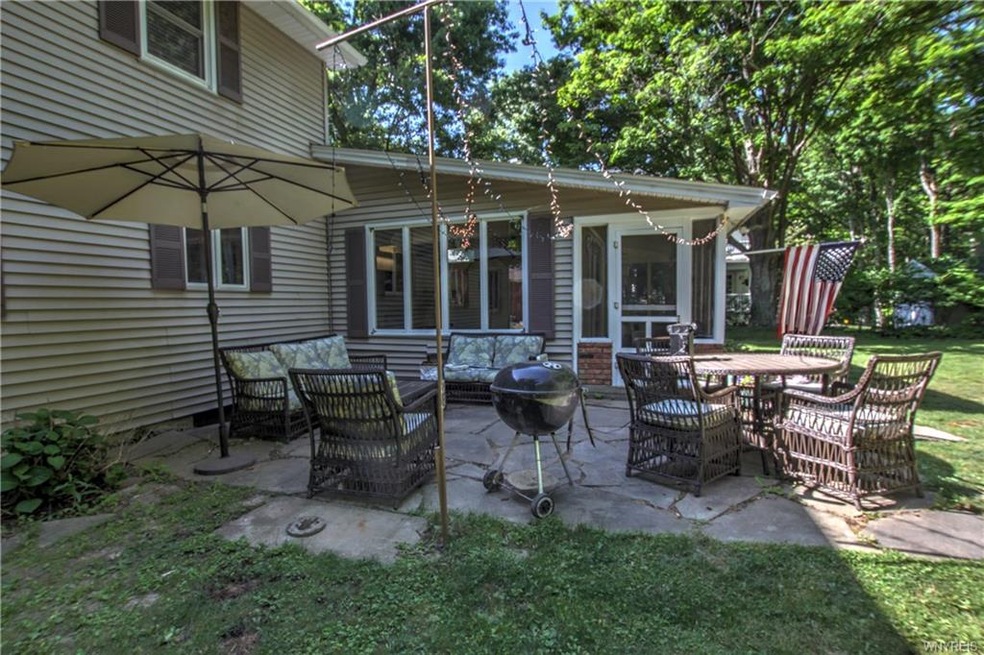 Flagstone patio and picturesque wooded lot