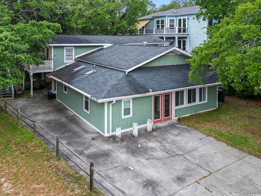 View of front of house featuring a shingled roof a