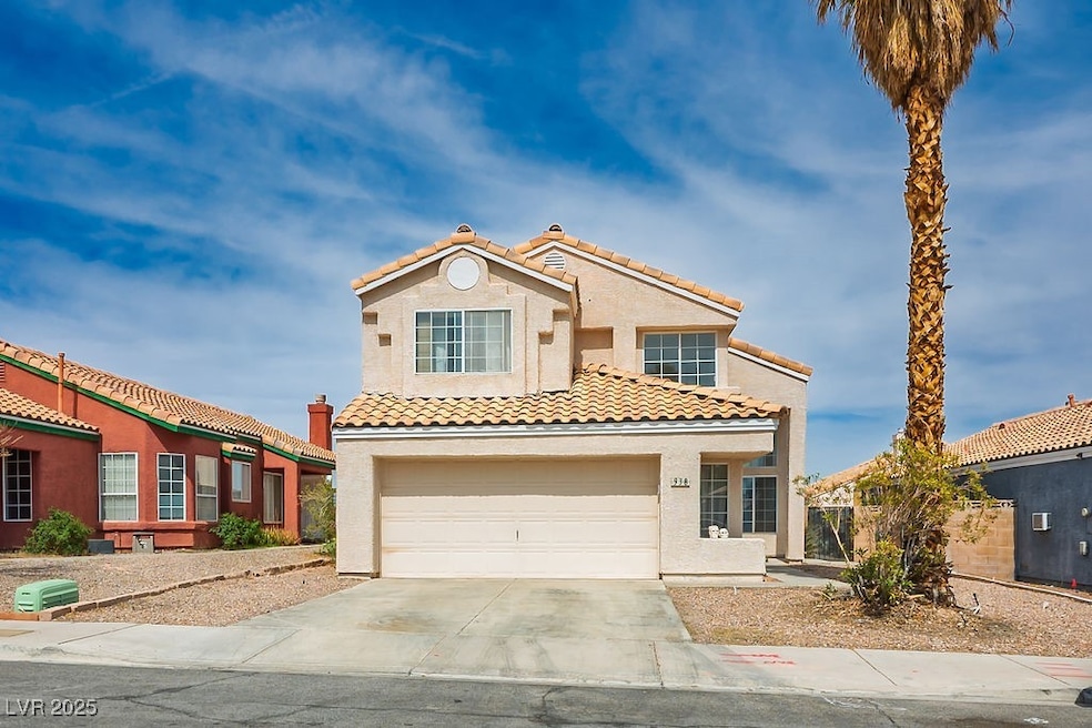 Mediterranean / spanish-style house featuring a ti