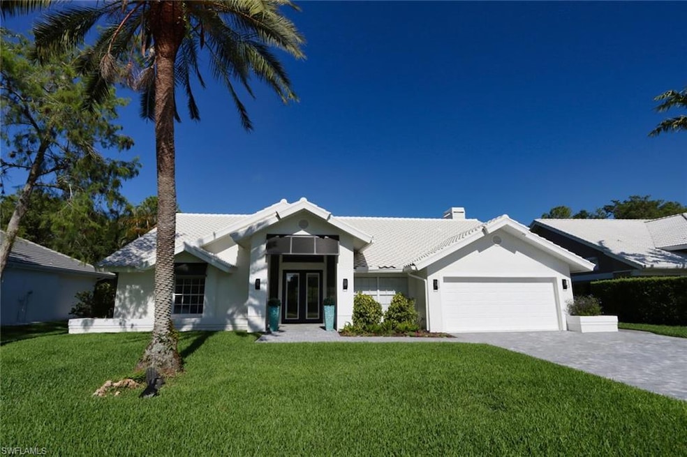 View of front of home featuring a garage and a fro