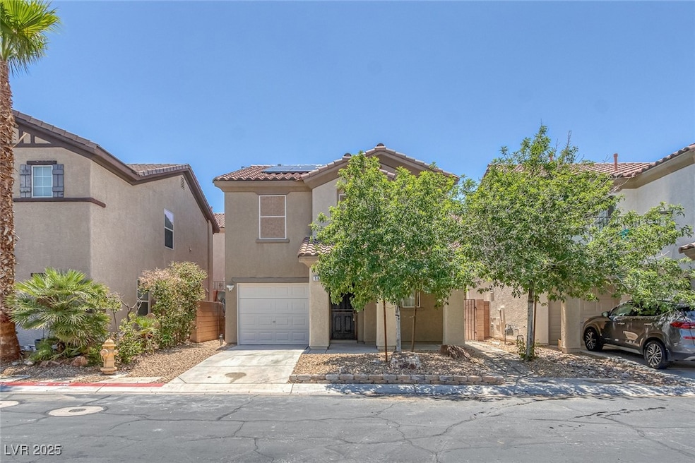 View of front of home featuring stucco siding, a t