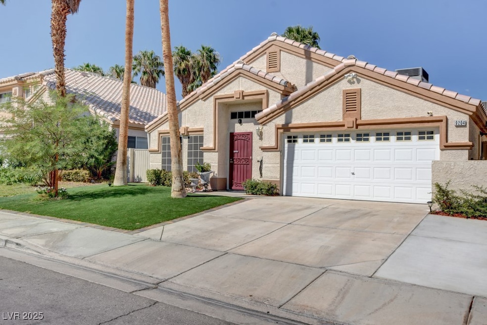 Traditional-style house with concrete driveway, an