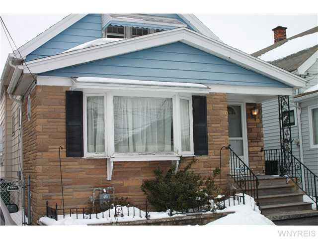Exterior Front. Exterior sided, covered porch lead