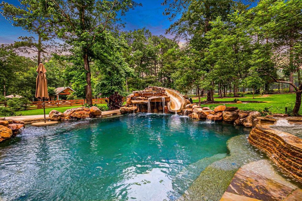Welcome home to 37332 Clubhouse Lane!  This sprawling backyard features a sparkling pool with rock waterfalls, waterslide, relaxing hot tub, and lush landscaping.