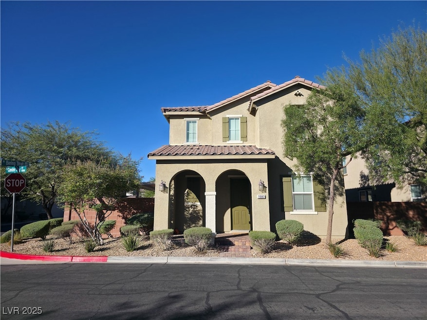 Mediterranean / spanish house with stucco siding and a tiled roof