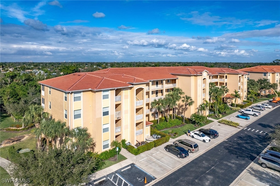 View of property with uncovered parking