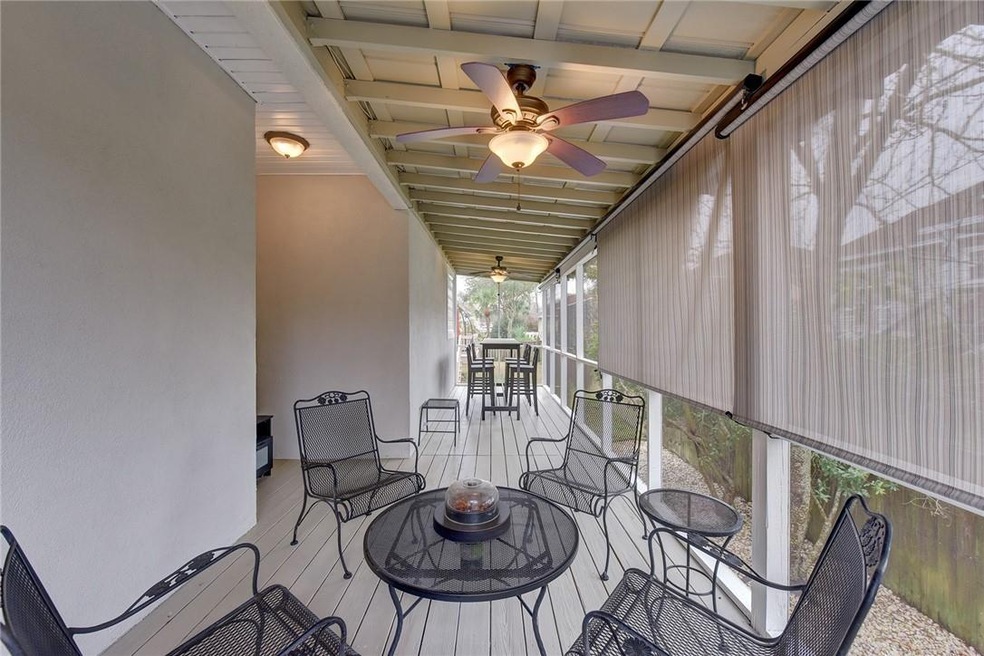Beautiful screened-in porch with sun shades, perfe