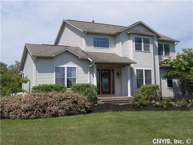 Exterior Front. Vinyl siding, brick walkway and ti