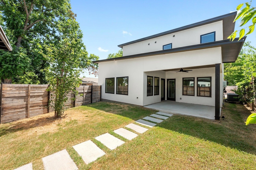 Back of property with a fenced backyard, a patio,