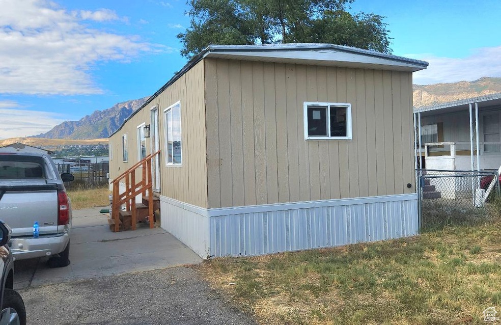View of side of property featuring a mountain view