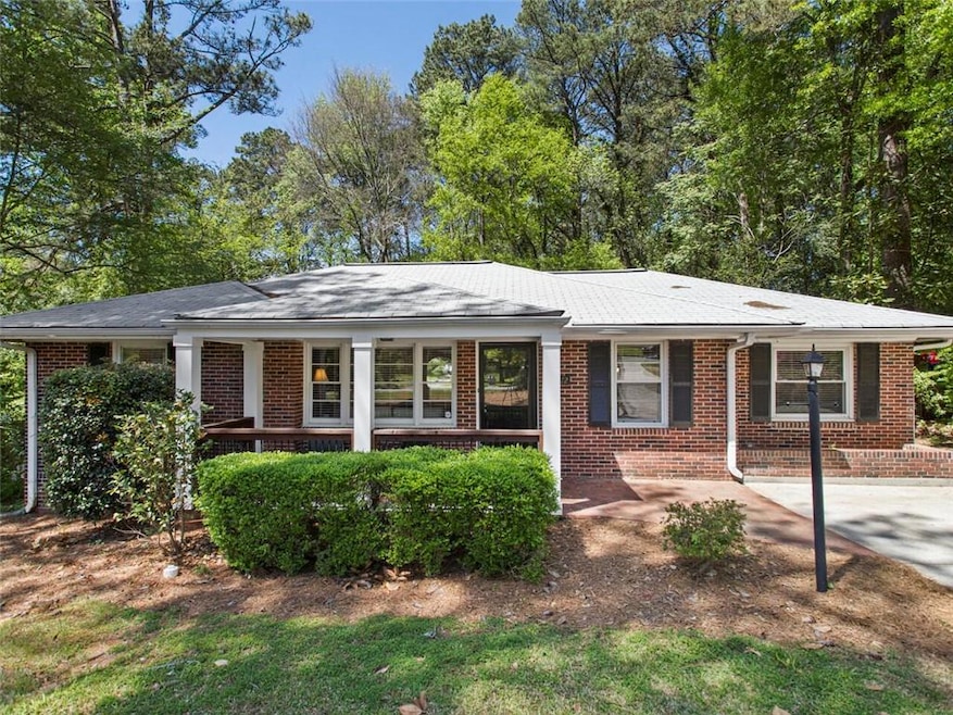 View of front of property featuring brick siding and a porch