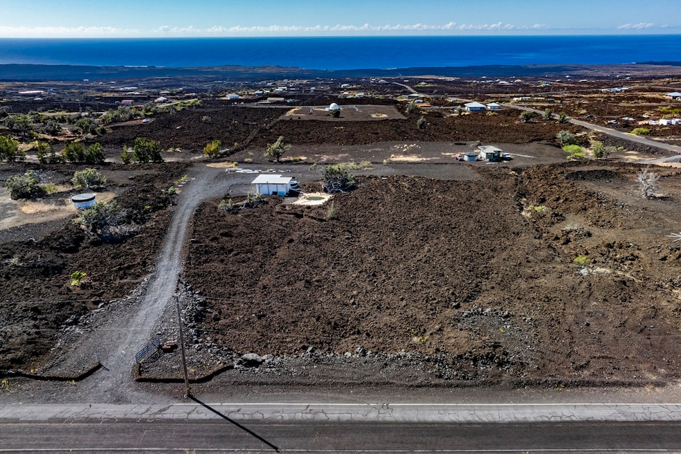 3 acres, stunning ocean views, driveway & house pad cut. Setback, private. Container & shed to get started.