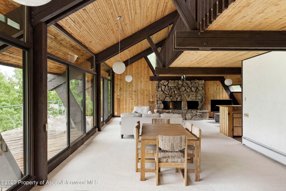 long view of living and dining and deck