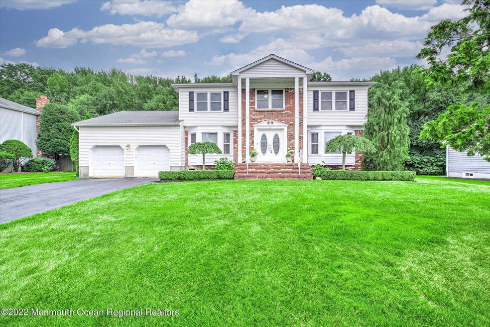 47 W Canadian Woods Rd, Manalapan, NJ 07726 - photo 1