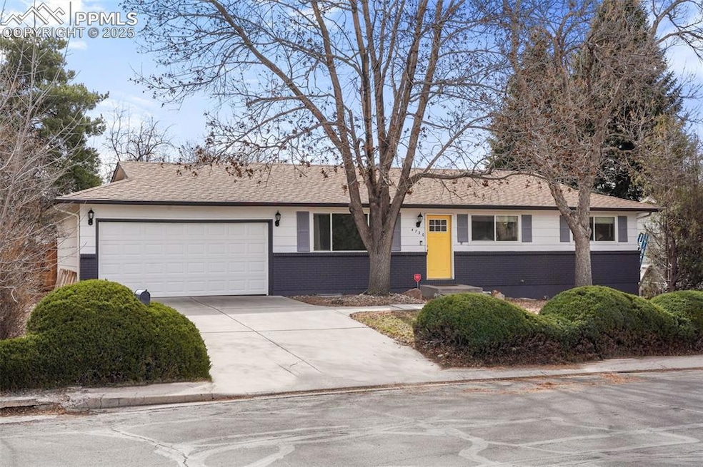 Ranch-style home with an attached garage, brick si