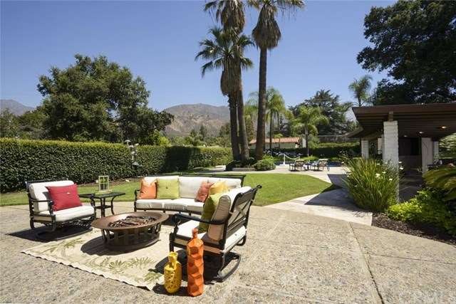 Rear patio with sitting area, covered lanai and po