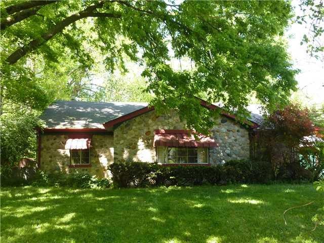 Exterior Front. Beautiful stone cottage type ranch home.