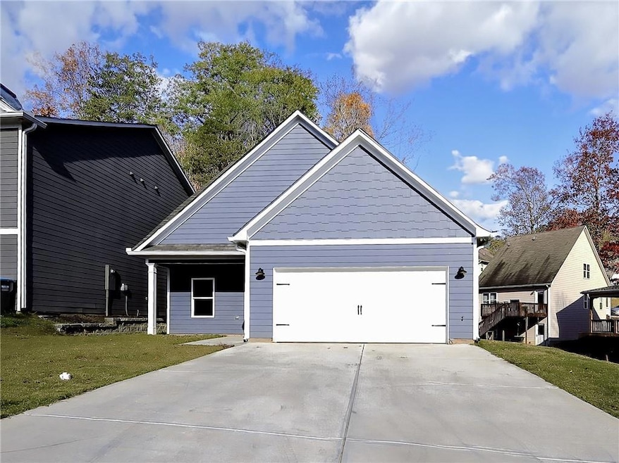 View of front of home featuring a front lawn and a
