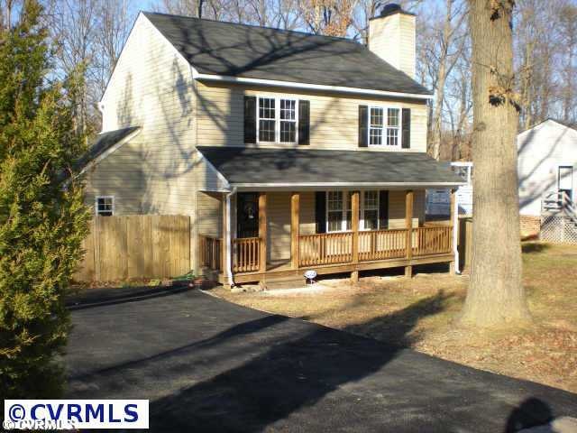 Exterior Front - Paved drive, fenced backyard, cor