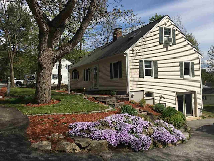 Beautifully landscaped and a great big White Oak t