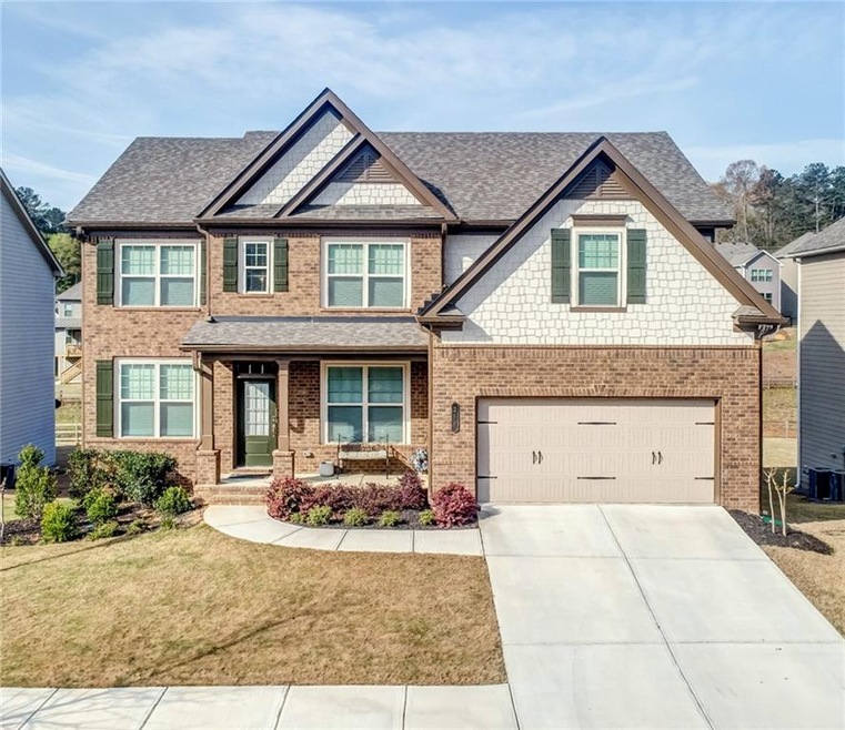 This nearly-new home features Concrete Siding, Bri