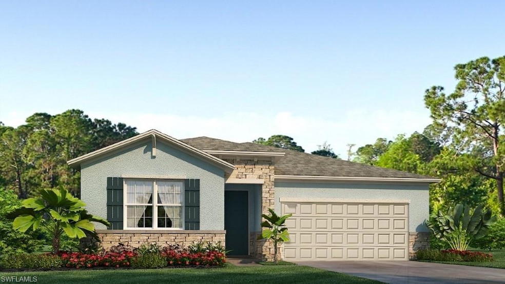 View of front of house with stone siding, an attached garage, and driveway