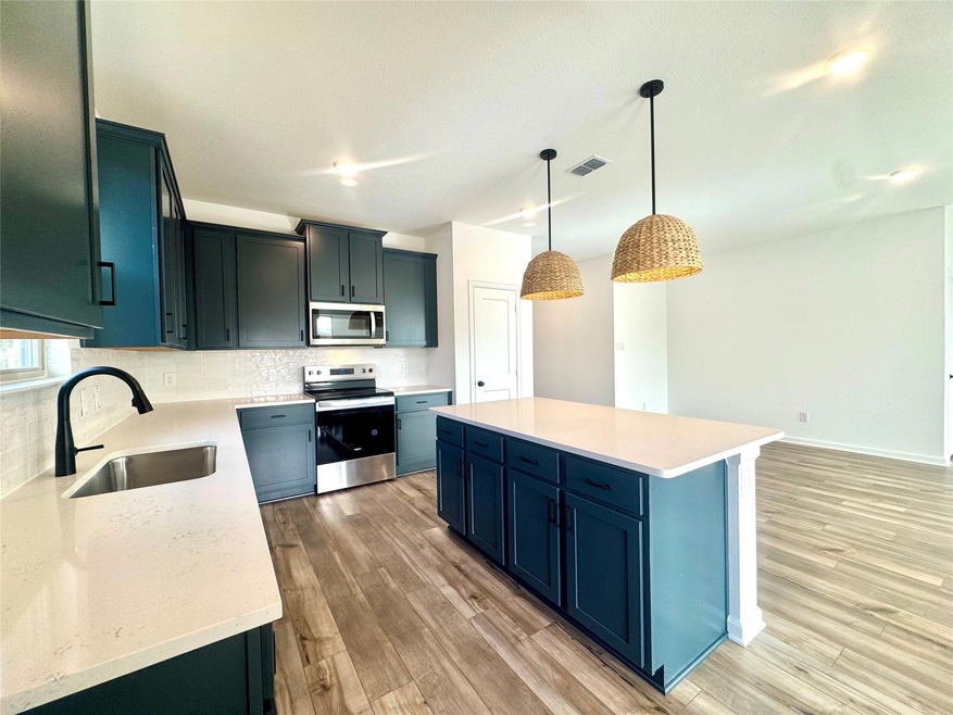 Kitchen featuring stainless steel appliances, visi