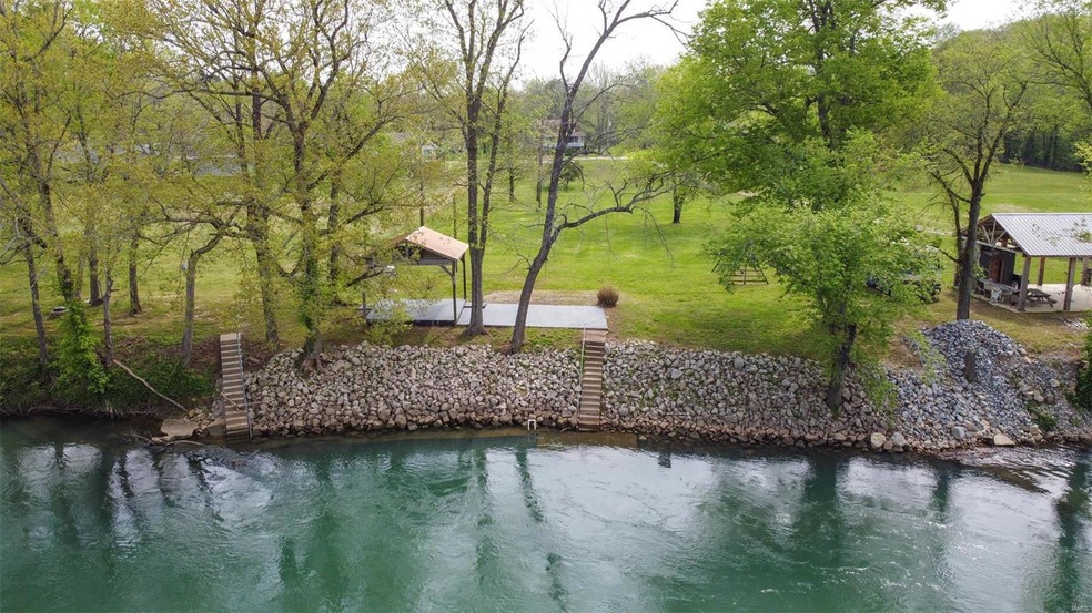 River bank has white rock to prevent erosion