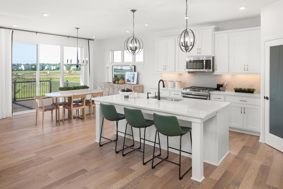 Welcome home to your new Amelia Floorplan!  Cook your favorite meal while entertaining your guests in this open concept floorplan.  (Photos of model, colors and materials will vary in actual home.)