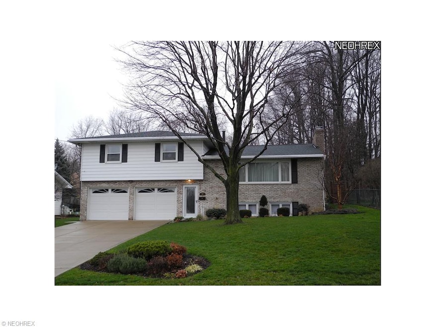 Cement drive.  Double car garage.  New storm doors