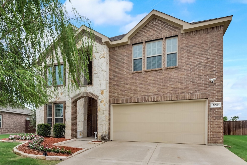 Dining space featuring a high ceiling and light hardwood / wood-style flooring