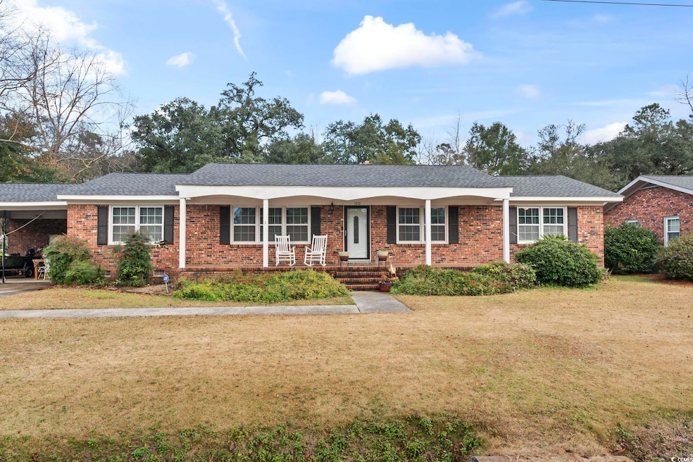Ranch-style home featuring a front lawn, covered p