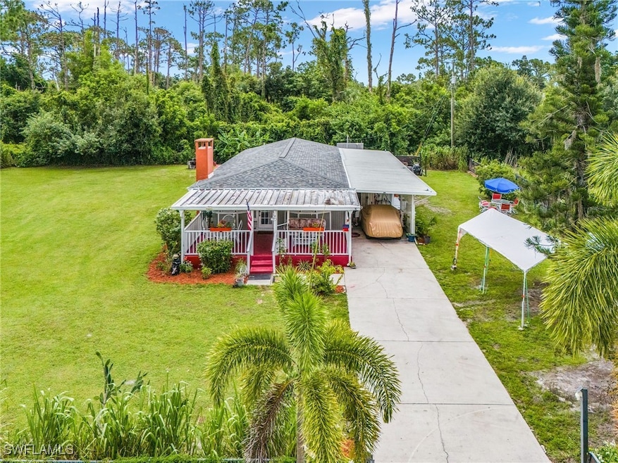 View of front of property featuring a porch, concr