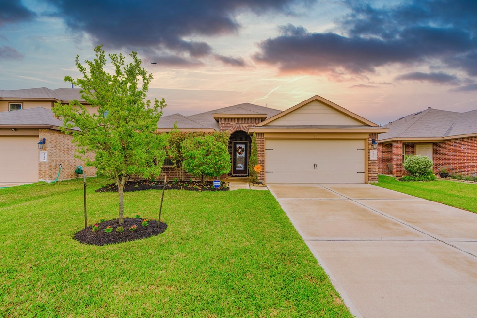 Welcome home to 29222 Jarvis Bay Pass located in the community of Tamarron and zoned to Lamar Consolidated ISD. This stunning home has lovely curb appeal, a well-manicured lawn, beautiful landscaping, brick elevation, dark stained front door with glass detailing, covered front entryway, beautiful outdoor lanterns, and a double wide driveway.