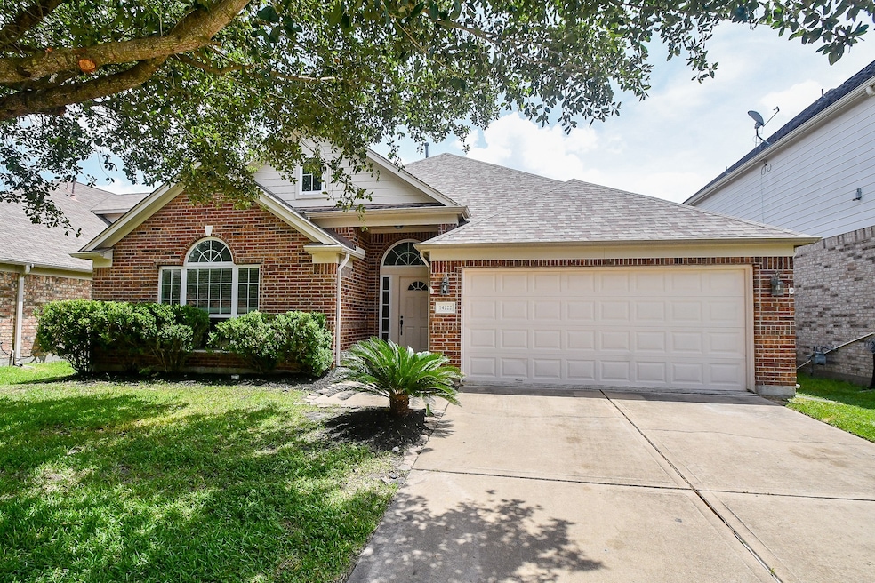 Charming brick home with a two-car garage and a we