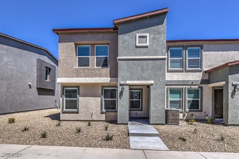 View of front of home with stucco siding and centr