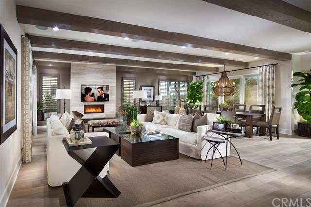 Lovely open floor plan with beamed ceilings and re