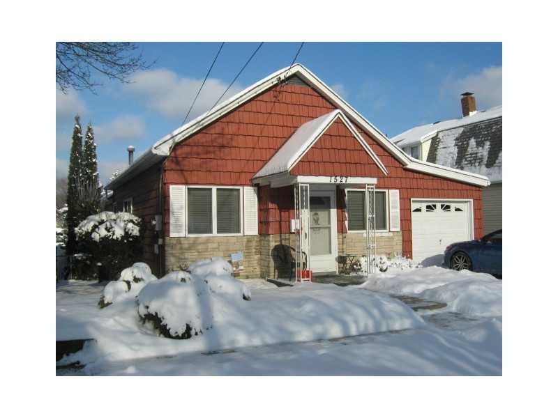 Exterior Front. Attached garage just a step into h