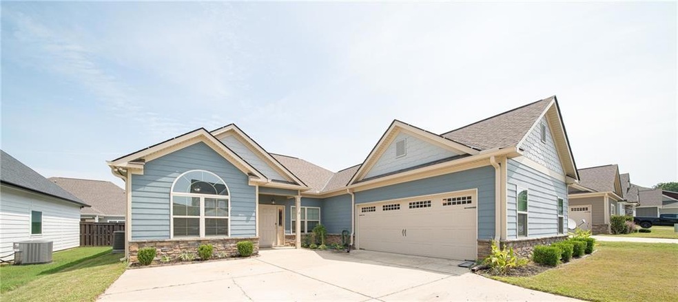 Craftsman-style home featuring a front yard and ce