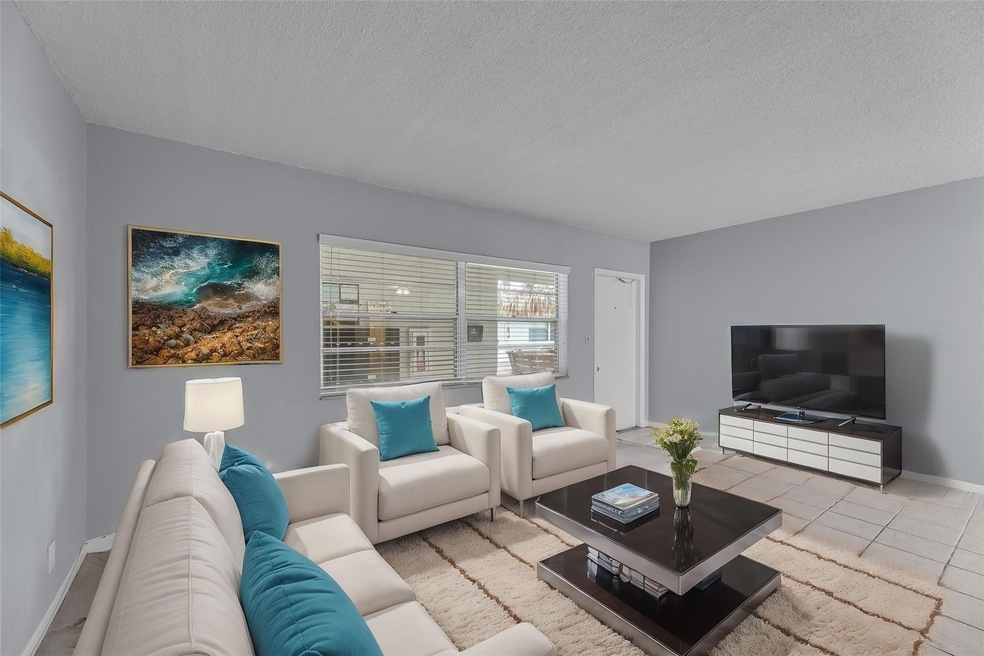 Spacious Living Room with Tile Flooring - staged p