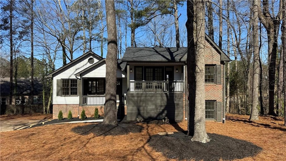 View of front of property featuring brick siding a