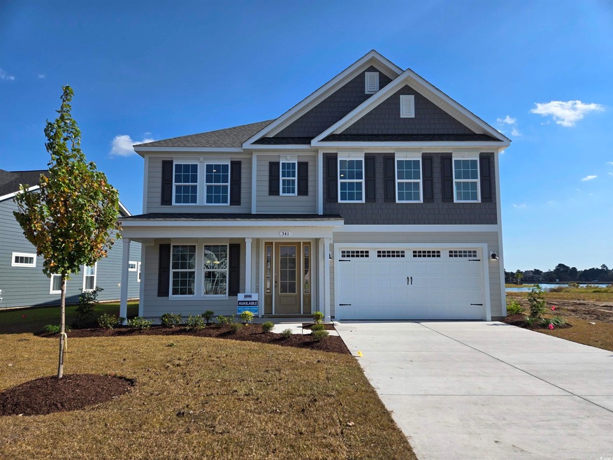 View of front of house featuring a garage and a fr