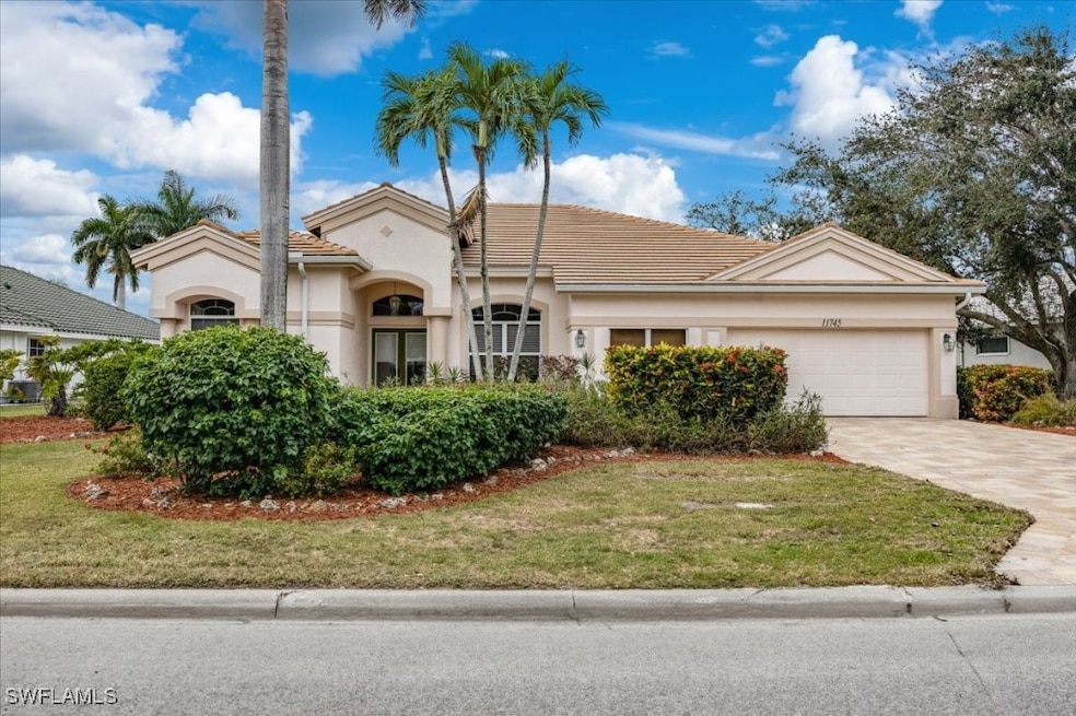 View of front of property featuring a garage and a