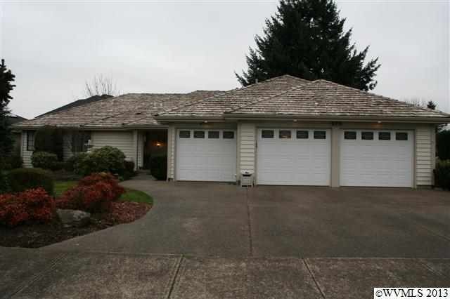 Front view with 3 car garage.