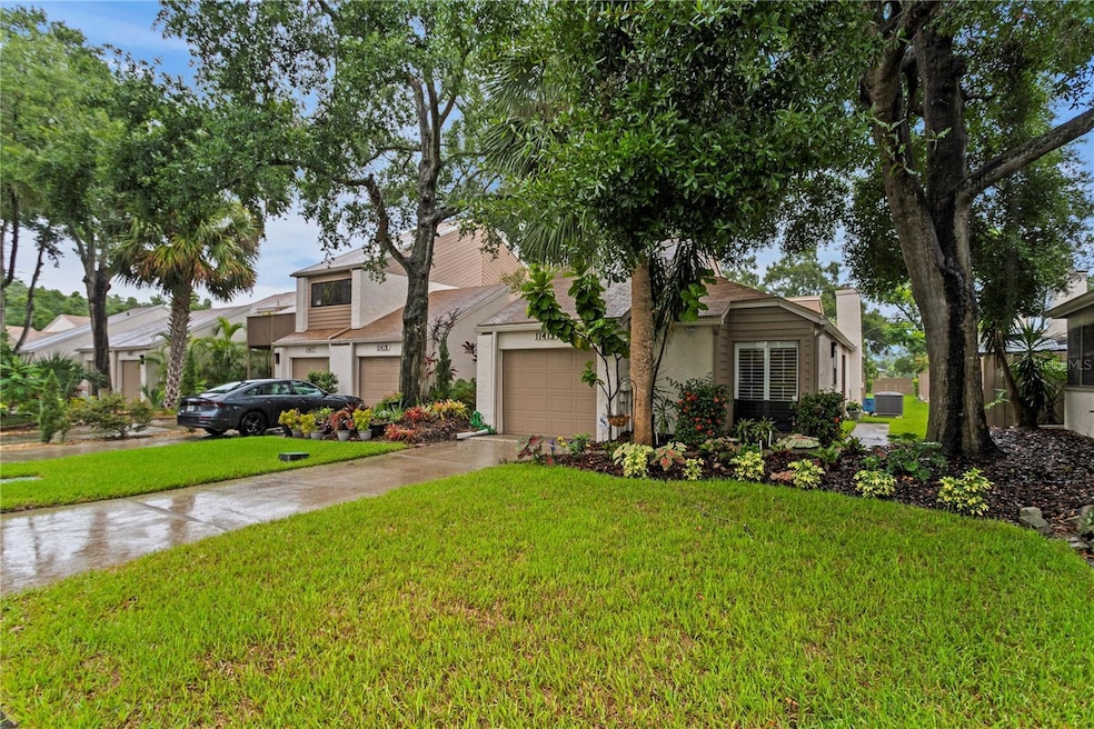 Welcome home to 11413 Galleria Drive located in Carrollwood, a lovely suburb of Tampa. End unit charm + one-car garage = easy living!