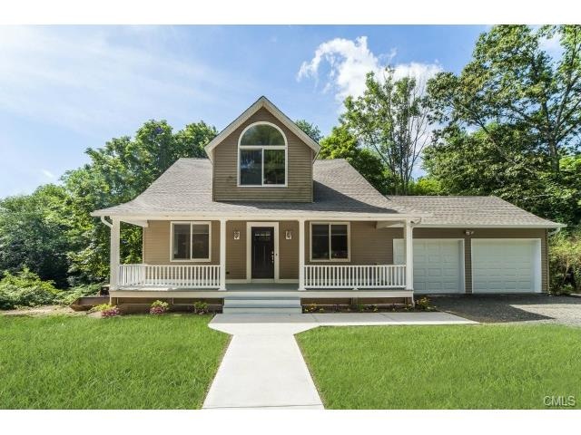 Comfortable front porch overlooks the new walkways